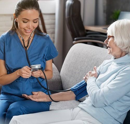 Professional nurse providing home nursing care
