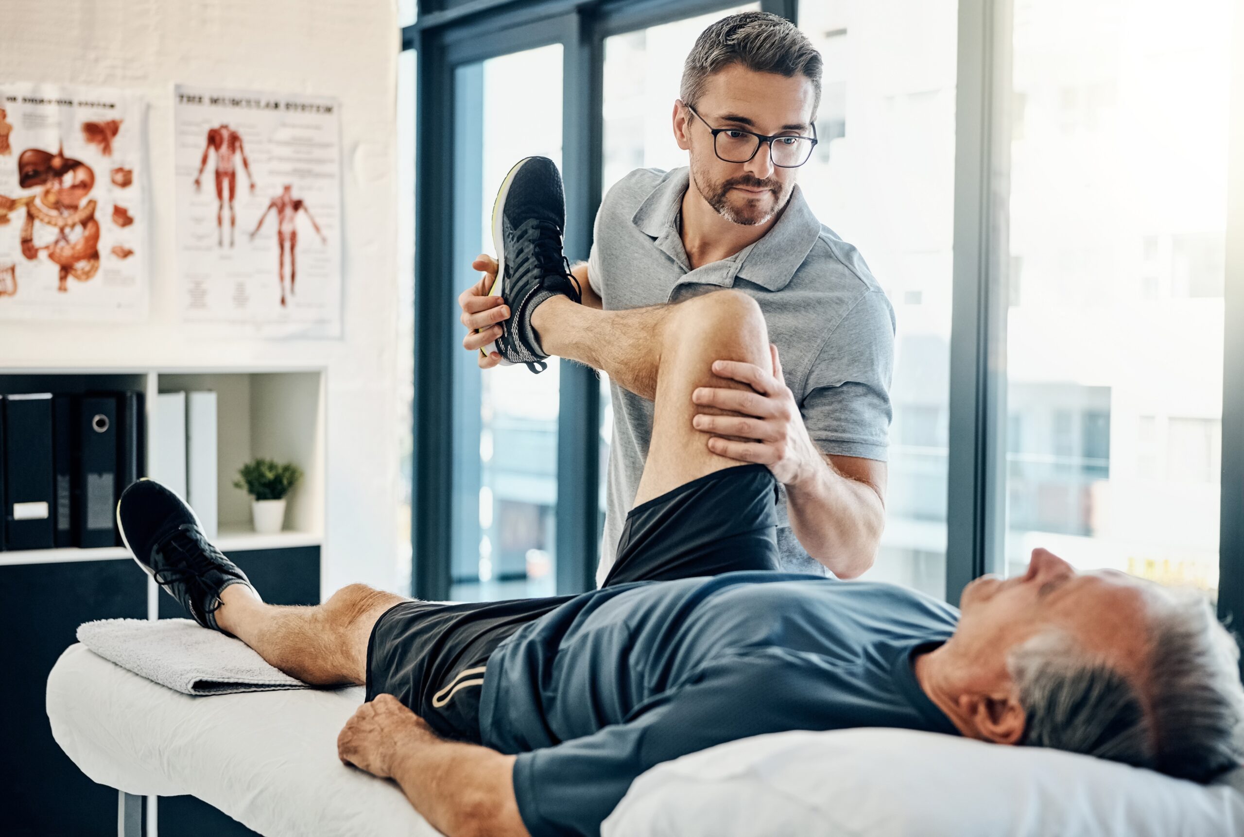 Physiotherapist assisting a patient at home