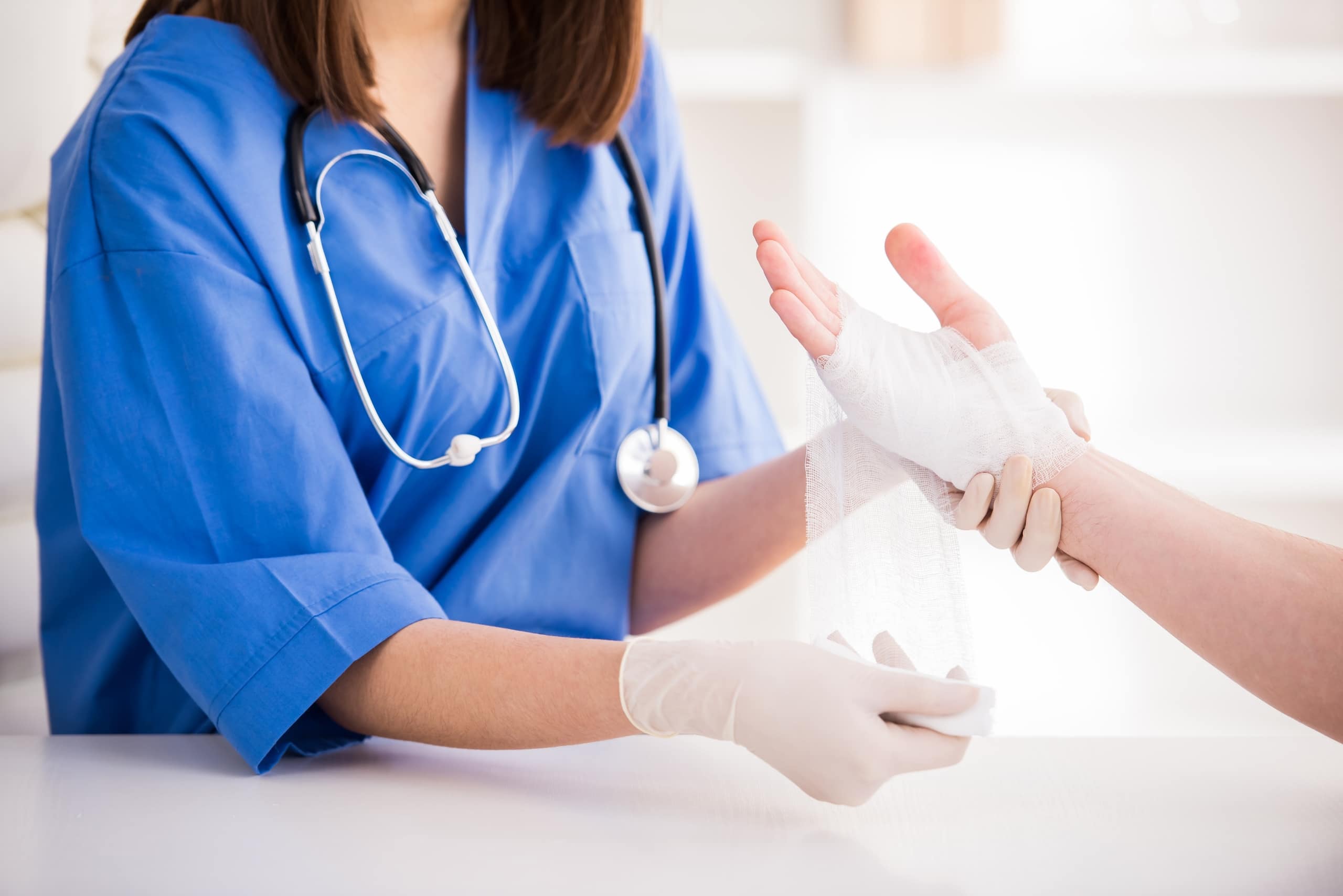 Nurse providing post-operative care to a patient