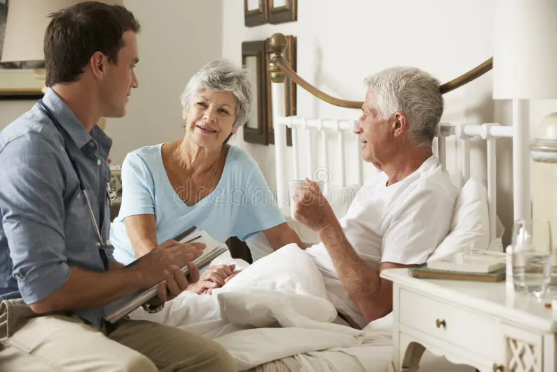 Doctor visiting a patient at home