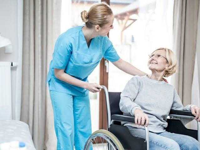 Professional nurse caring for a patient at home